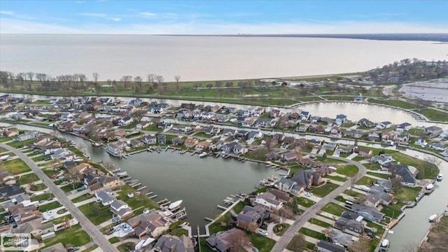 bird's eye view featuring a residential view and a water view