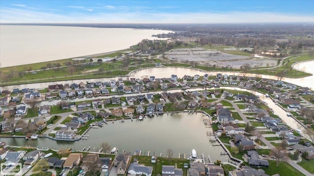 birds eye view of property with a residential view and a water view