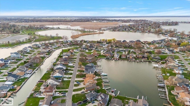 bird's eye view featuring a water view and a residential view