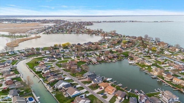 birds eye view of property featuring a water view and a residential view