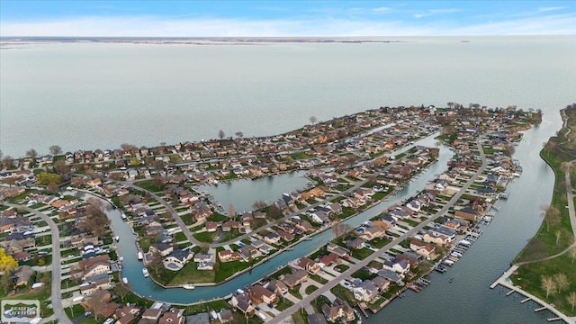 birds eye view of property featuring a residential view and a water view