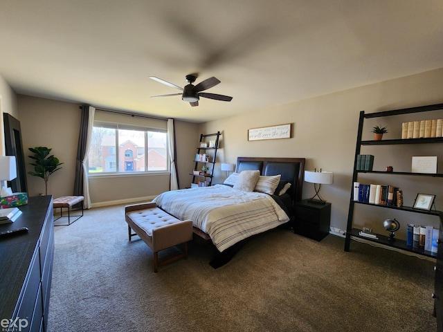 carpeted bedroom featuring baseboards and a ceiling fan