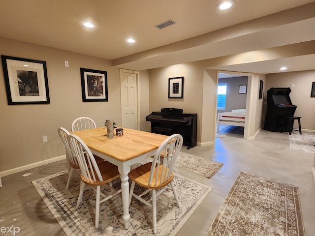 dining space featuring recessed lighting, finished concrete flooring, and baseboards
