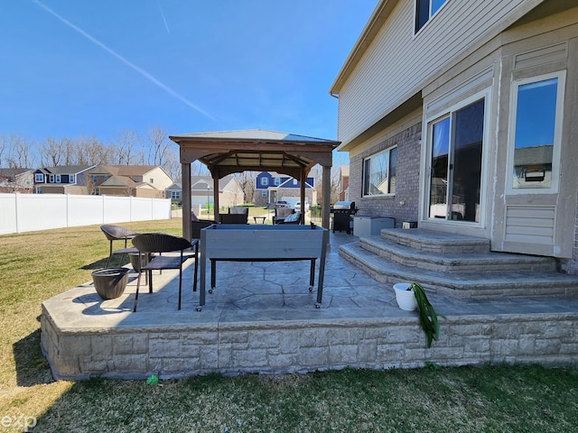 view of patio / terrace with a grill, fence, entry steps, an outdoor living space, and a gazebo