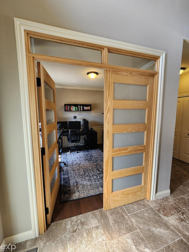 corridor featuring baseboards