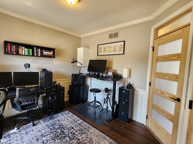 office area with wood finished floors, visible vents, crown molding, and a wainscoted wall