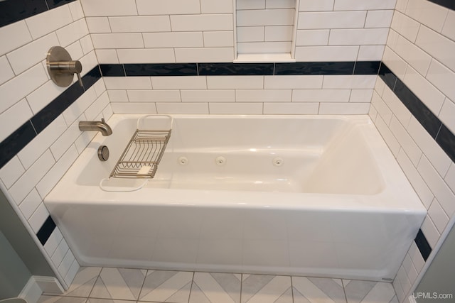 full bathroom featuring tile patterned flooring and a tub to relax in