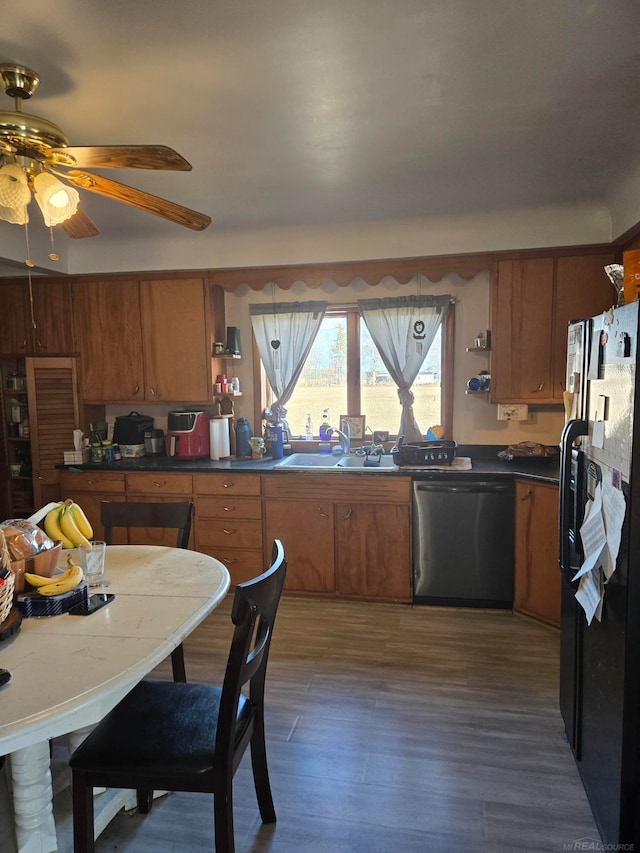 2255 E Sanilac Rd, Carsonville, MI 48419 - kitchen with black refrigerator with ice dispenser, dishwasher, brown cabinets, and open shelves