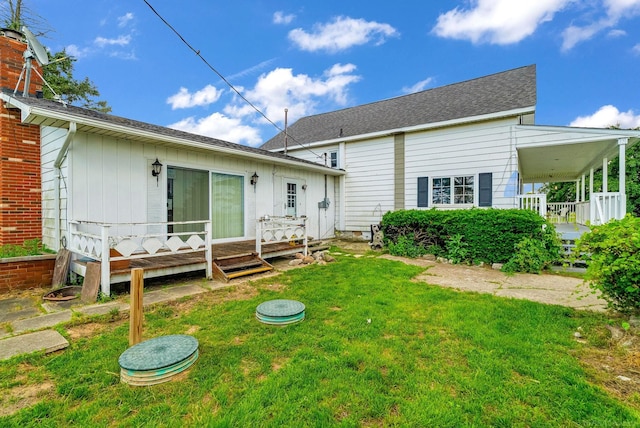 2255 E Sanilac Rd, Carsonville, MI 48419 - back of house with a yard, a deck, and a shingled roof