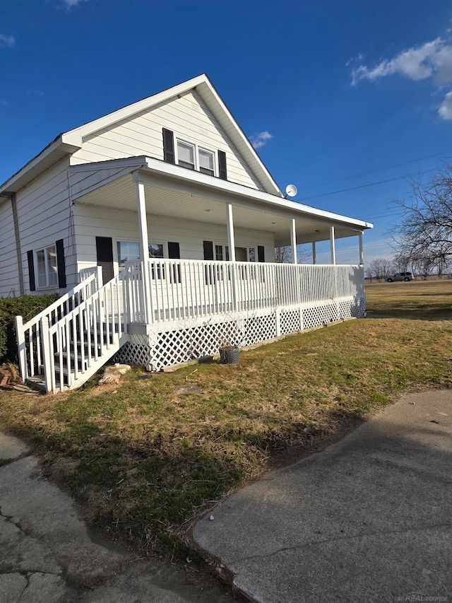 2255 E Sanilac Rd, Carsonville, MI 48419 - view of front of property with a porch and a front yard