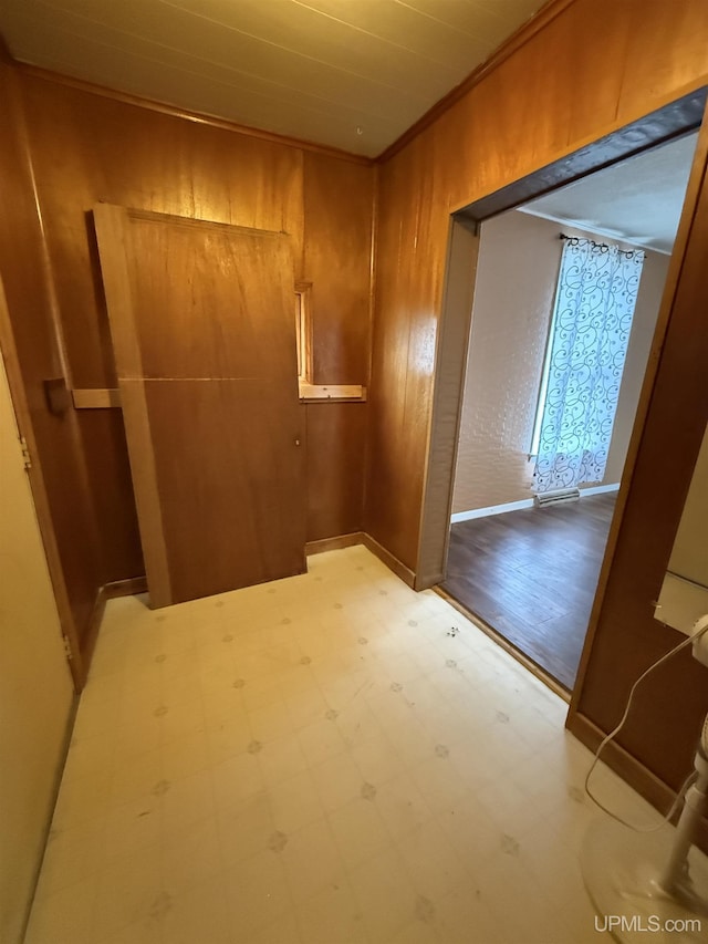 231 E Chocolay St, Munising, MI 49862 - corridor featuring tile patterned floors, baseboards, and ornamental molding