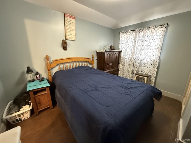 231 E Chocolay St, Munising, MI 49862 - bedroom with wood finished floors and baseboards