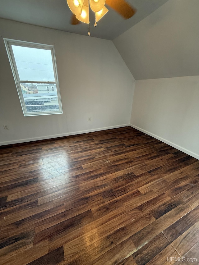 231 E Chocolay St, Munising, MI 49862 - bonus room with dark wood finished floors, lofted ceiling, a ceiling fan, and baseboards