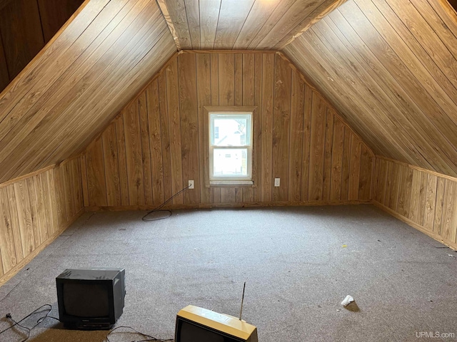 231 E Chocolay St, Munising, MI 49862 - bonus room featuring vaulted ceiling, wooden walls, and a wood stove