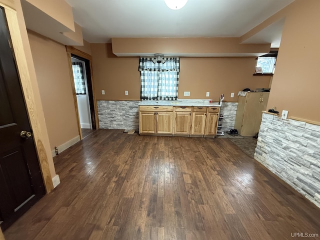231 E Chocolay St, Munising, MI 49862 - kitchen with wainscoting, light countertops, and dark wood finished floors