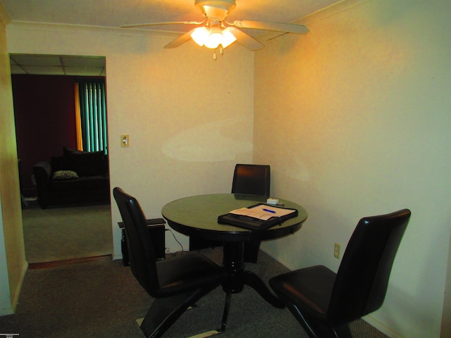 dining area with baseboards, carpet flooring, and ceiling fan