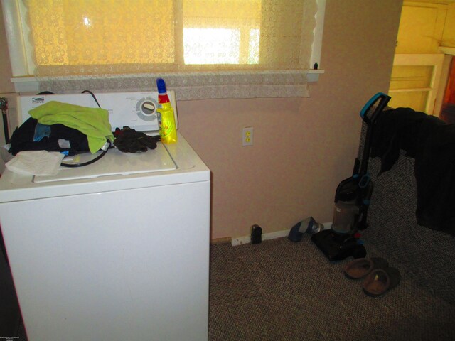 washroom with baseboards, carpet floors, laundry area, and washer / clothes dryer