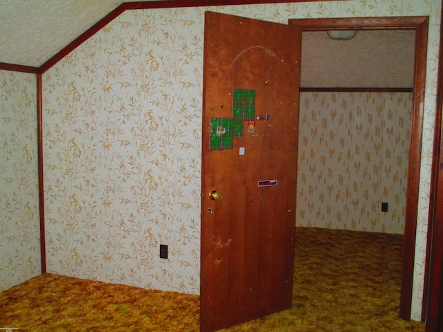 interior space with wallpapered walls and carpet floors