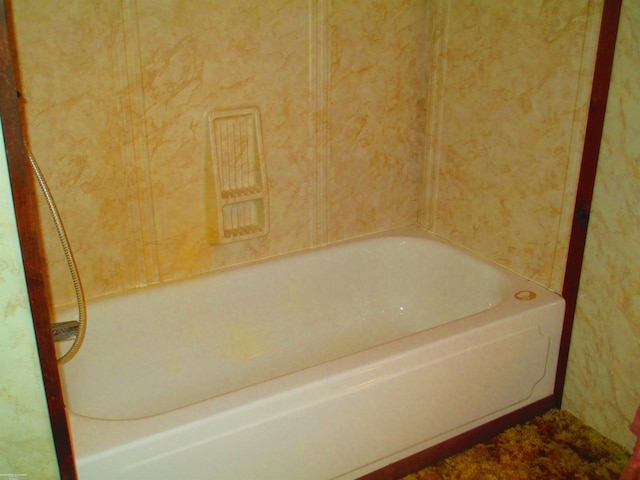 bathroom featuring a washtub
