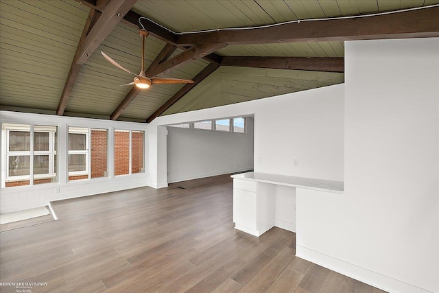 interior space with wood finished floors, vaulted ceiling with beams, wooden ceiling, baseboards, and ceiling fan