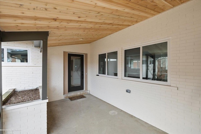 property entrance with brick siding