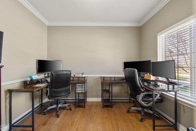 office space featuring wood finished floors, baseboards, and ornamental molding