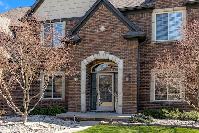 entrance to property with brick siding