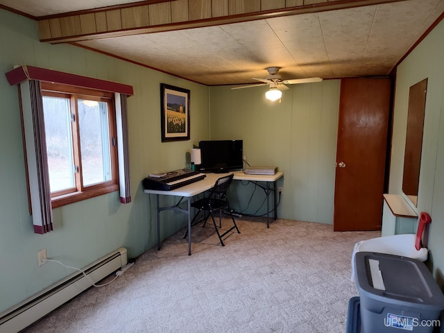 office space featuring carpet, wood walls, baseboard heating, and ceiling fan