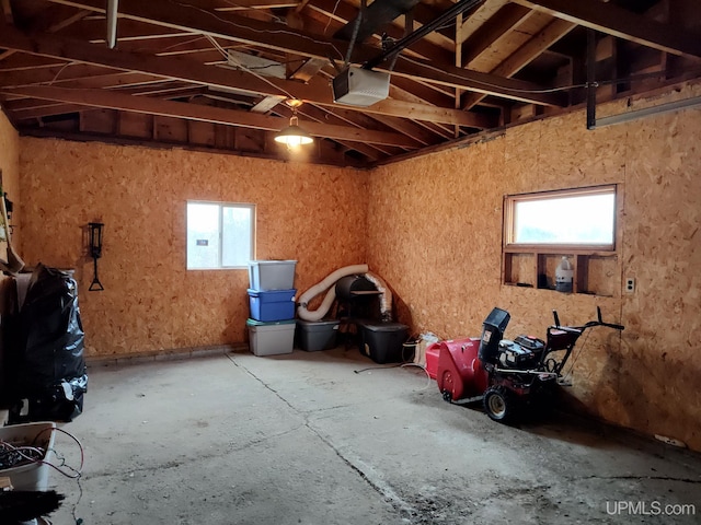 misc room featuring a garage and concrete flooring