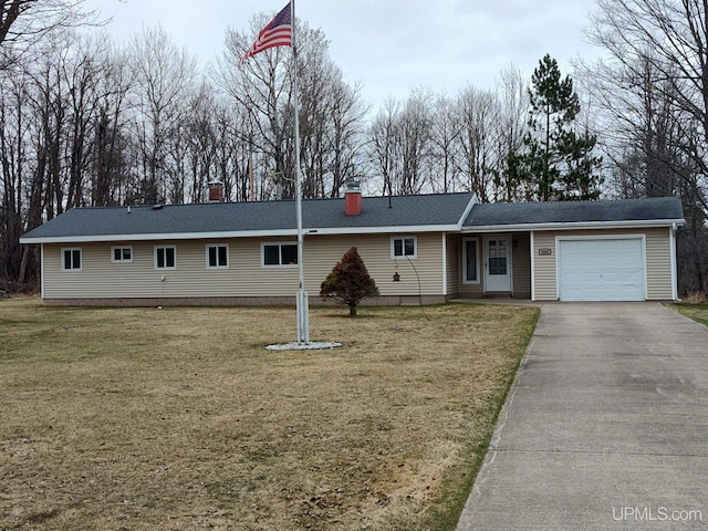 ranch-style home featuring aphalt driveway, a front yard, and a garage