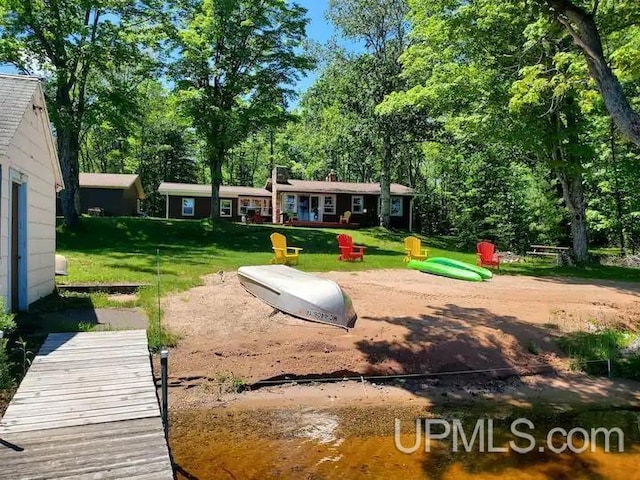 surrounding community with a yard