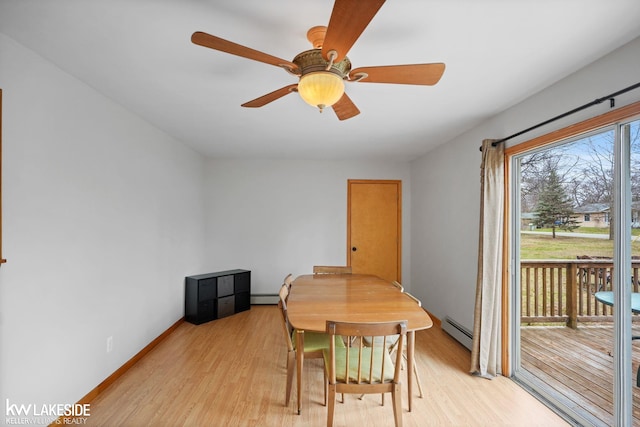 dining area with light wood-type flooring, baseboard heating, baseboards, and a ceiling fan