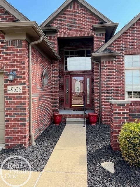 entrance to property with brick siding