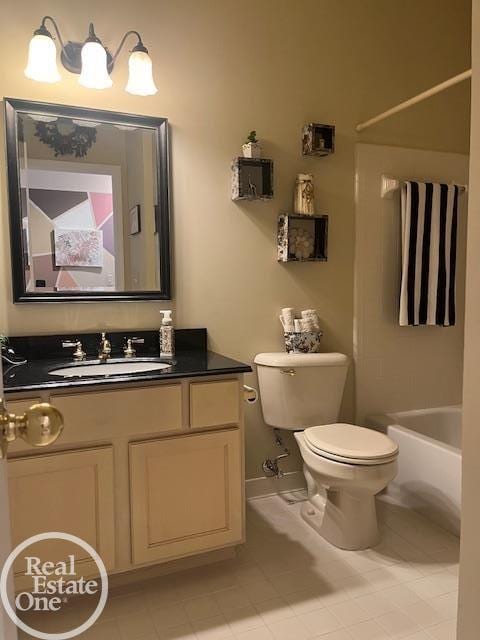 full bath featuring toilet, baseboards, tile patterned flooring, washtub / shower combination, and vanity