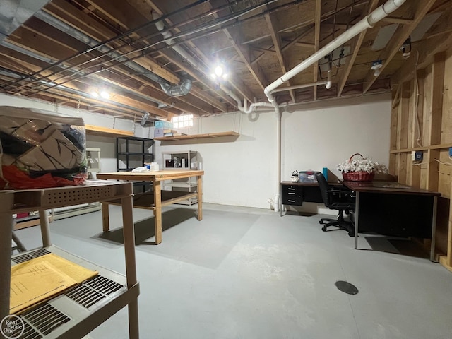 unfinished basement with a workshop area