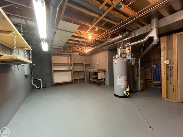 unfinished basement featuring heating unit and gas water heater