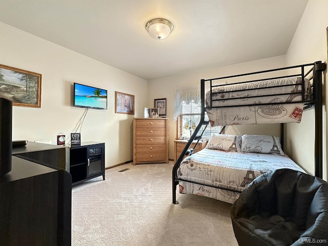 carpeted bedroom with baseboards