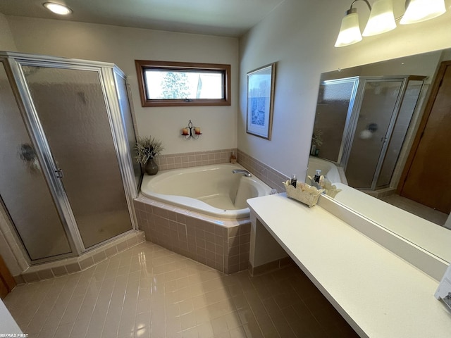 full bathroom with a bath, a shower stall, and tile patterned floors