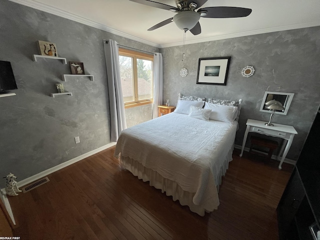 bedroom featuring baseboards, visible vents, a ceiling fan, wood finished floors, and crown molding