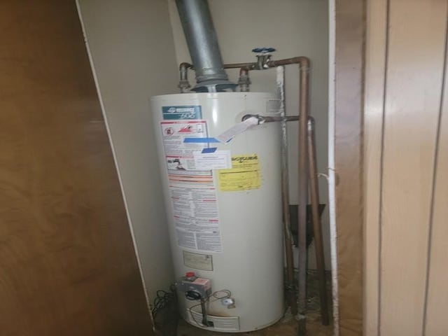utility room with water heater