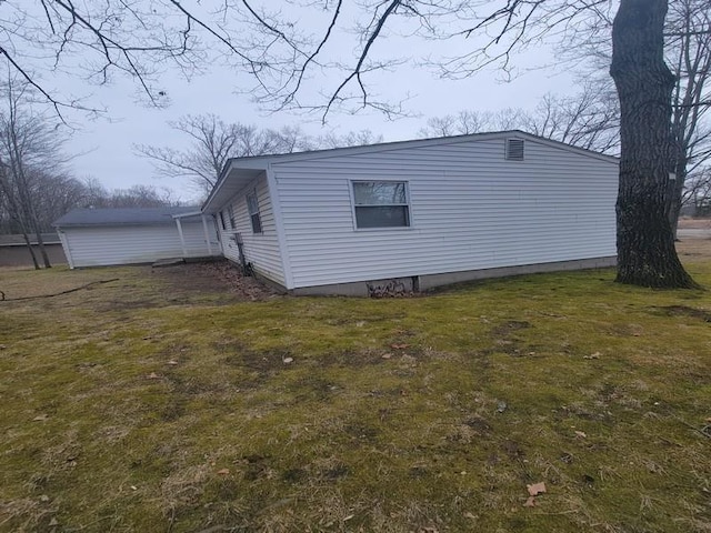 view of side of property with a yard