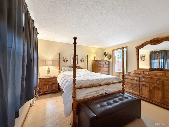 2709 W 6th Ave, Gladstone, MI 49837 - bedroom featuring a textured ceiling and light carpet