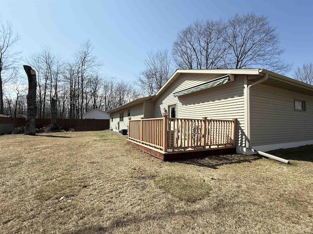 2709 W 6th Ave, Gladstone, MI 49837 - view of side of property featuring fence, a yard, and a deck