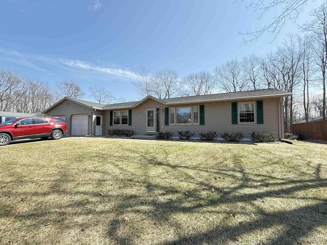 2709 W 6th Ave, Gladstone, MI 49837 - single story home with a front yard and a garage