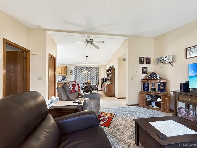 2709 W 6th Ave, Gladstone, MI 49837 - living room with baseboards, vaulted ceiling, light colored carpet, and ceiling fan with notable chandelier