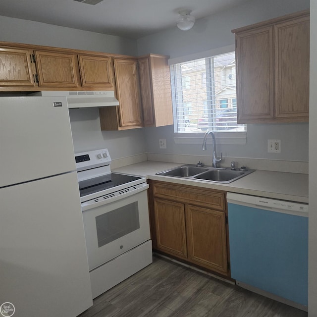 30288 Wedgewood Cir, Roseville, MI 48066 - kitchen with light countertops, dark wood-style flooring, a sink, and white appliances