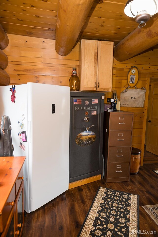 kitchen with wood ceiling, wooden walls, freestanding refrigerator, and dark wood-type flooring
