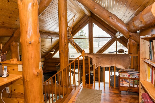 interior space with wood finished floors, vaulted ceiling with beams, and wood ceiling