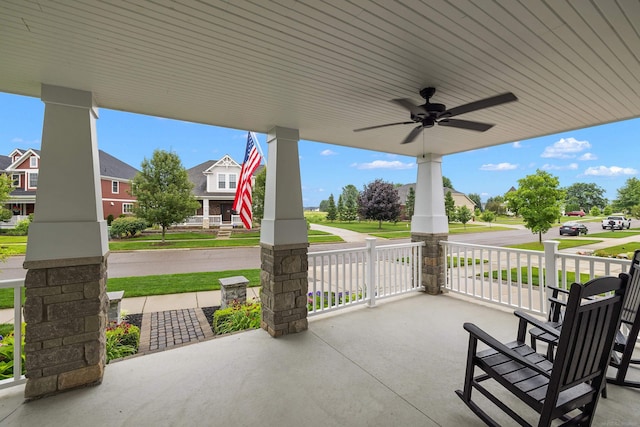 view of patio with a porch, a residential view, and ceiling fan
