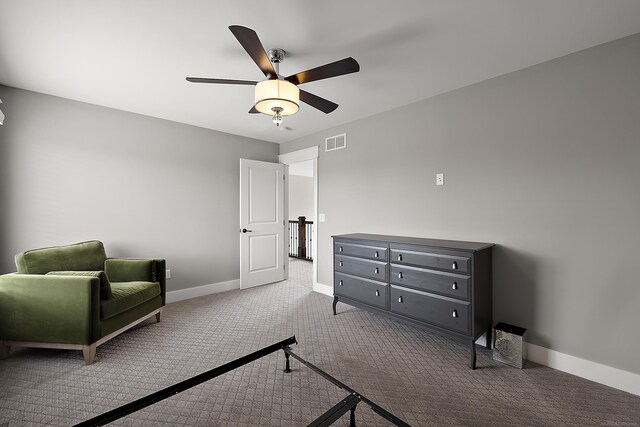 bedroom with baseboards, a ceiling fan, visible vents, and carpet flooring